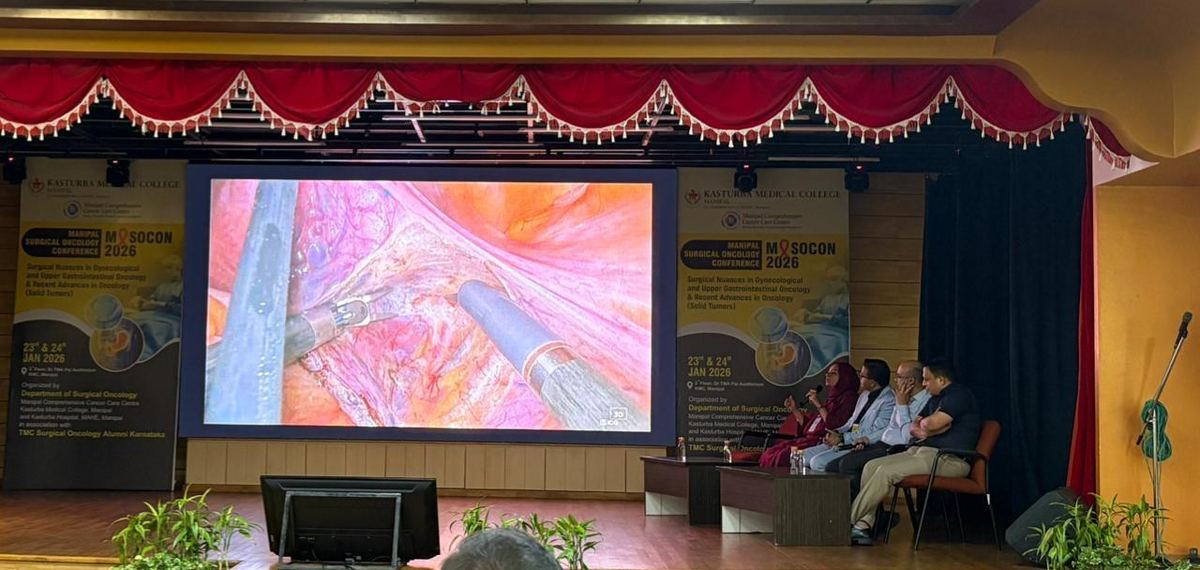 MASOCON 2026 — live surgical presentation on stage at Kasturba Medical College, Manipal